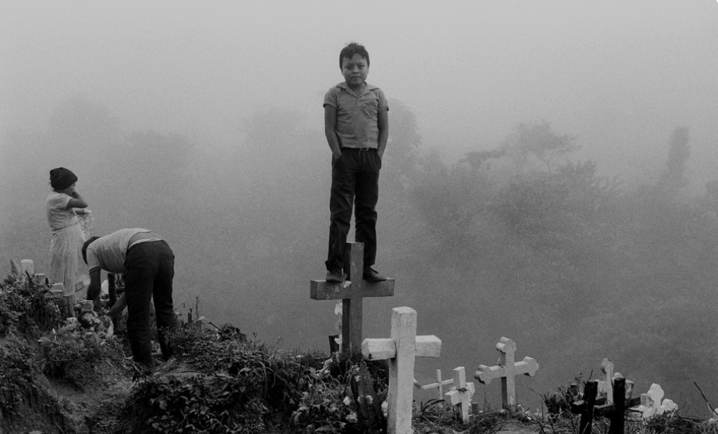 Boy on Tombstone Cross_Jean Gaumy