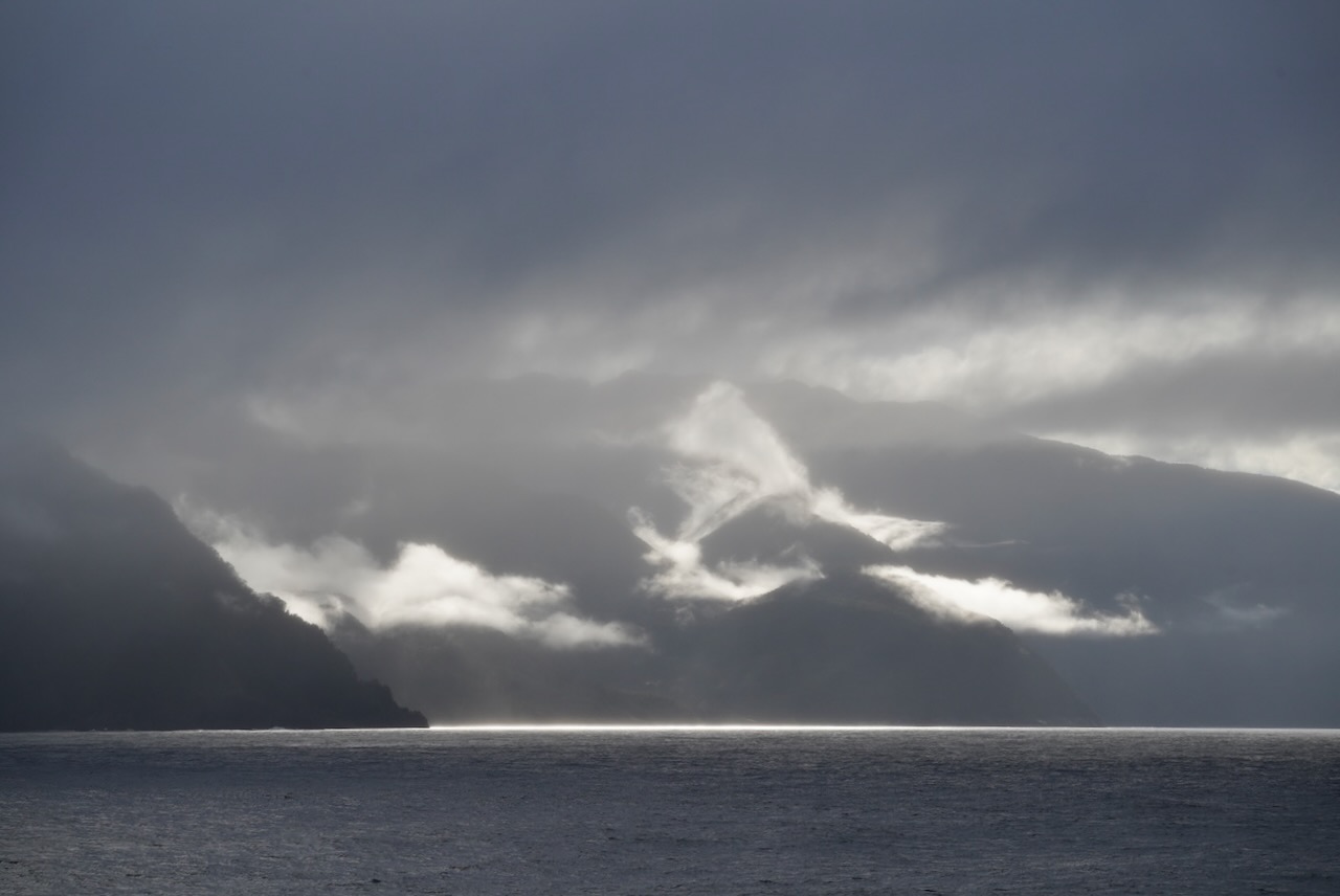 Mountains sky ocean dark clouds_journal of wild culture